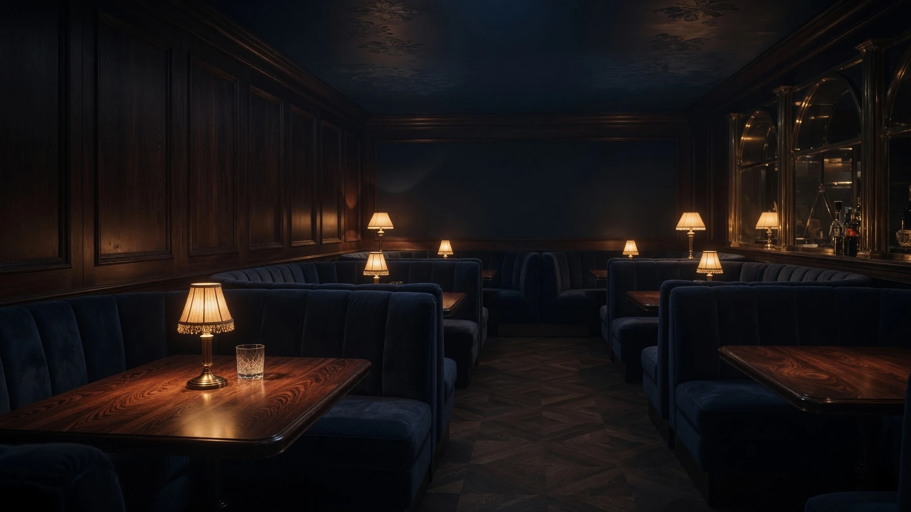The room at Ush — booths in navy velvet, a lamp low on every table, no windows
